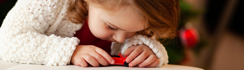 Nina adores playing with toys cars and dreams to become a driver.